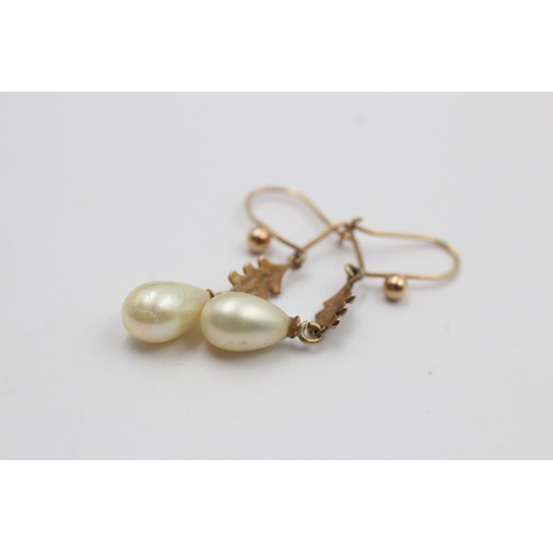 93 - A pair of 9ct gold ornate faux pearl drop earrings - approx. gross weight 2.1 grams