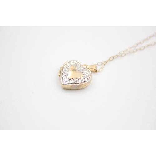 98 - A 9ct gold bicolour patterned heart locket pendant necklace - approx. gross weight 1.6 grams