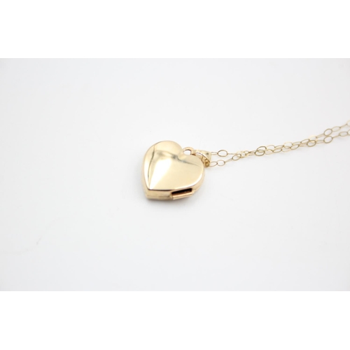 98 - A 9ct gold bicolour patterned heart locket pendant necklace - approx. gross weight 1.6 grams