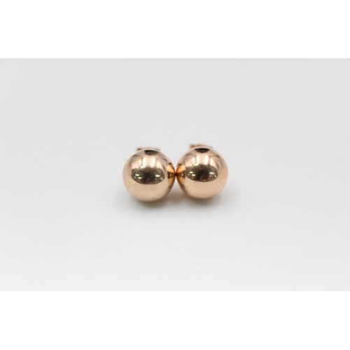 99 - A pair of 14ct gold large ball stud earrings - approx. gross weight 1.6 grams
