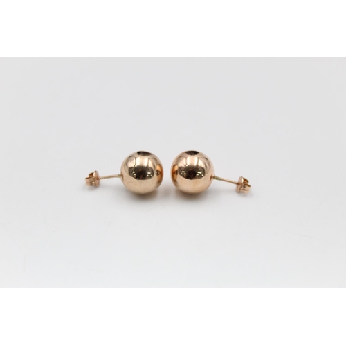 99 - A pair of 14ct gold large ball stud earrings - approx. gross weight 1.6 grams