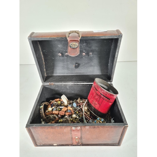 607 - A leather jewellery box containing various costume jewellery
