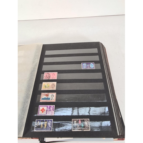 608 - A stamp album containing a collection of various stamps