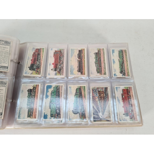 614 - A large collection of vintage Wills's cigarette cards to include Household Hints, Lucky Charms, Rail... 