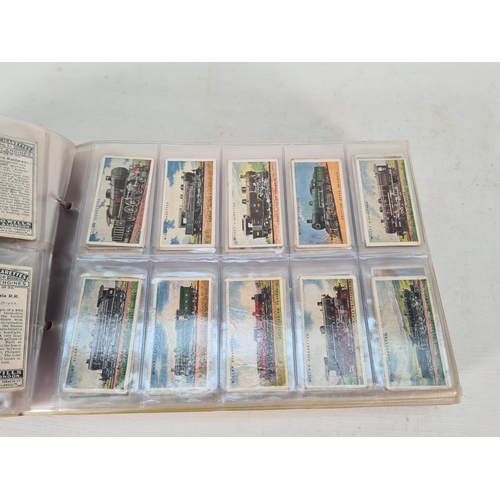 614 - A large collection of vintage Wills's cigarette cards to include Household Hints, Lucky Charms, Rail... 