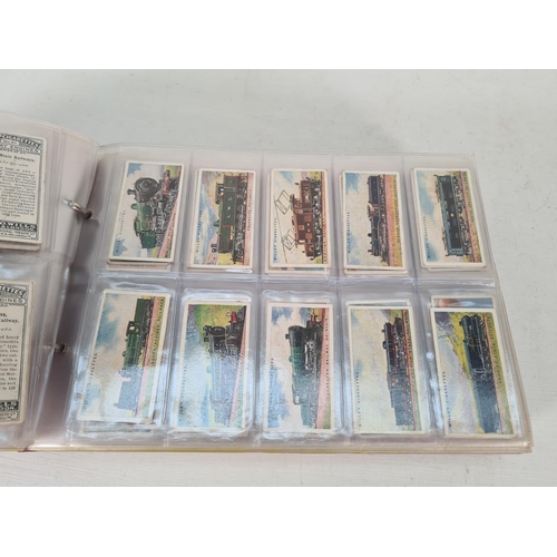 614 - A large collection of vintage Wills's cigarette cards to include Household Hints, Lucky Charms, Rail... 