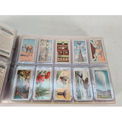 614 - A large collection of vintage Wills's cigarette cards to include Household Hints, Lucky Charms, Rail... 