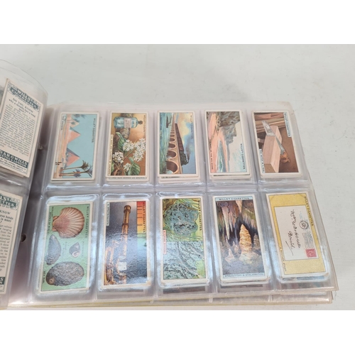 614 - A large collection of vintage Wills's cigarette cards to include Household Hints, Lucky Charms, Rail... 