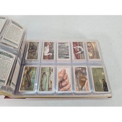 614 - A large collection of vintage Wills's cigarette cards to include Household Hints, Lucky Charms, Rail... 