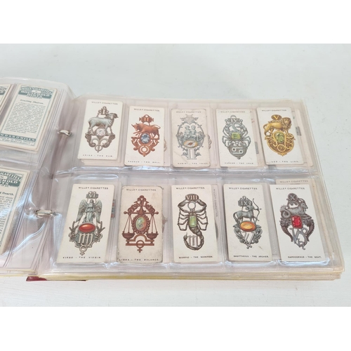 614 - A large collection of vintage Wills's cigarette cards to include Household Hints, Lucky Charms, Rail... 