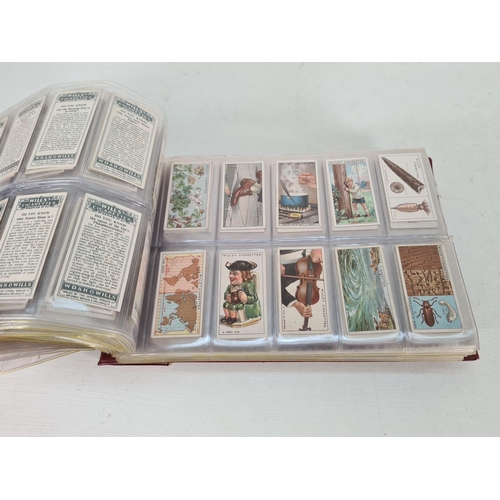 614 - A large collection of vintage Wills's cigarette cards to include Household Hints, Lucky Charms, Rail... 