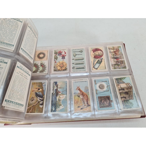 614 - A large collection of vintage Wills's cigarette cards to include Household Hints, Lucky Charms, Rail... 