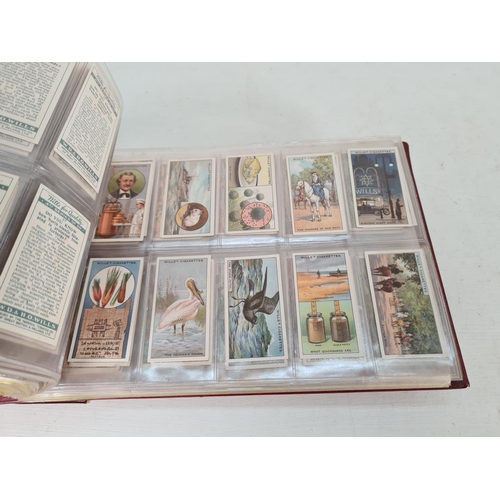 614 - A large collection of vintage Wills's cigarette cards to include Household Hints, Lucky Charms, Rail... 