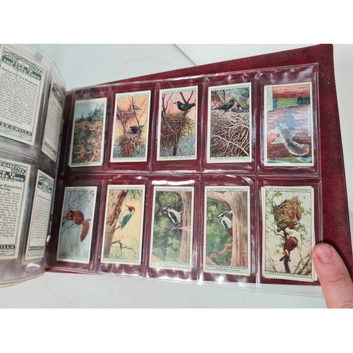 614 - A large collection of vintage Wills's cigarette cards to include Household Hints, Lucky Charms, Rail... 