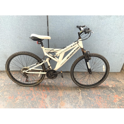 A white Muddy Fox Icarus dual suspension mountain bike with fifteen speed Sun Run gear system