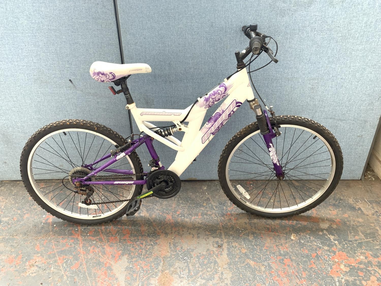 A white Avigo Pandora dual suspension mountain bike with eighteen speed gear system