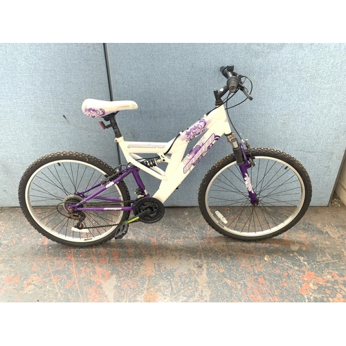 A white Avigo Pandora dual suspension mountain bike with eighteen speed gear system