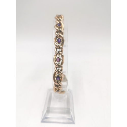 252 - A hallmarked London import 9ct gold heart padlock amethyst set curb link bracelet - approx. gross we... 