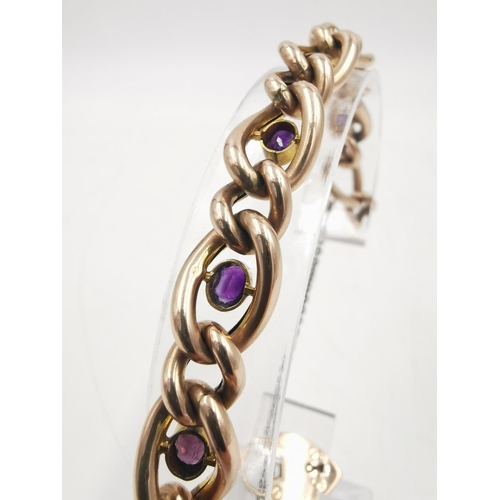 252 - A hallmarked London import 9ct gold heart padlock amethyst set curb link bracelet - approx. gross we... 