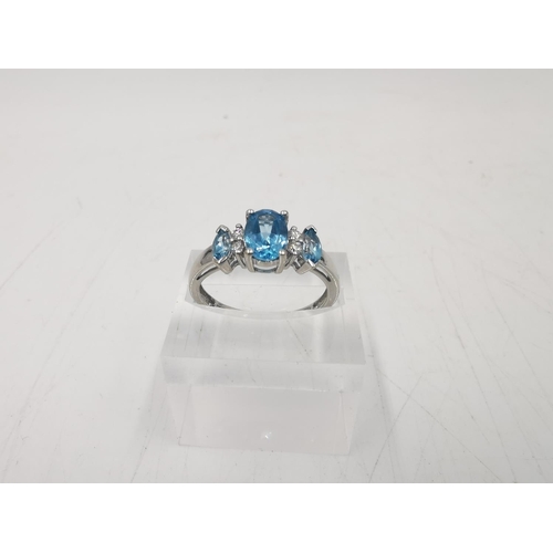 273 - A hallmarked Sheffield 14ct white gold blue topaz and diamond ring, size N ½ - approx. gross weight ... 