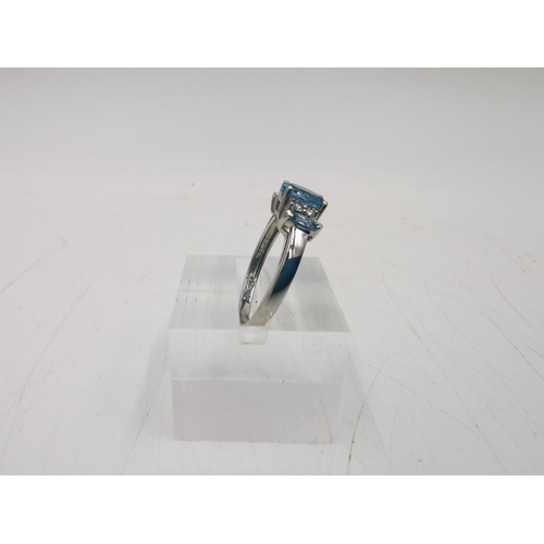 273 - A hallmarked Sheffield 14ct white gold blue topaz and diamond ring, size N ½ - approx. gross weight ... 