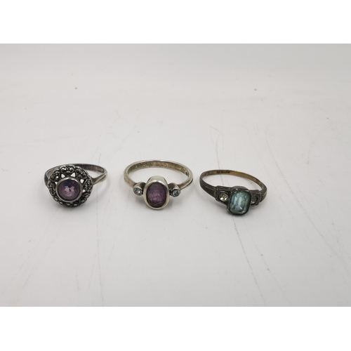 276 - Ten assorted silver rings to include .925 onyx and marcasite - size S, sterling opal - size R, Siam ... 