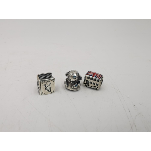 279 - Ten Pandora .925 silver charms to include fairy tale book, granddaughter, Union Jack bus, little gir... 