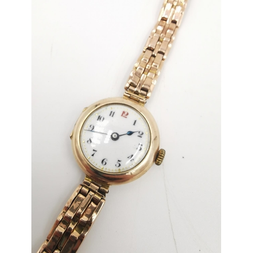 310 - A George V hallmarked 9ct gold Swiss made ladies wristwatch with white enamel face, circa 1915 - app... 