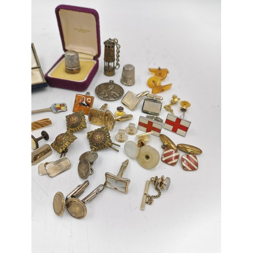 319 - A large assortment of items to include hallmarked Birmingham silver and enamel Altrincham collectors... 