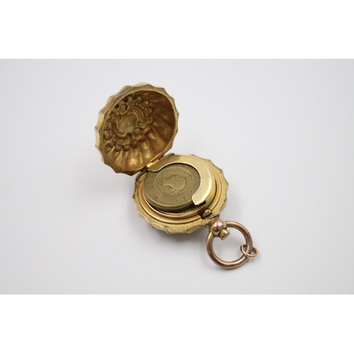 328 - A Victorian rolled gold sovereign case with 1843 Royal Mint token