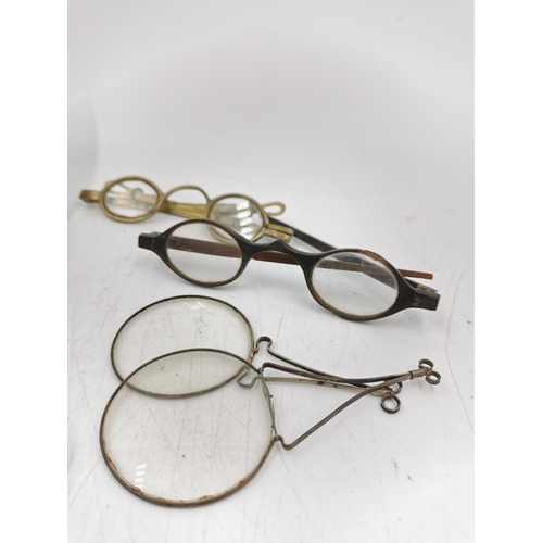 329 - A collection of antique and vintage spectacles and optical instruments to include bakelite framed sp... 