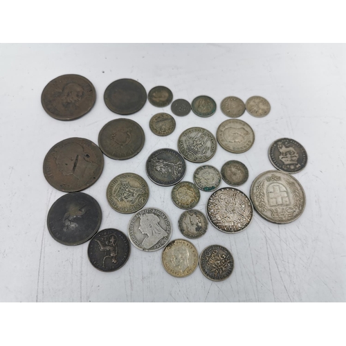 330 - A collection of assorted worldwide coins to include 1913 Mehmed V .833 silver five Qirsh, 1933 .835 ... 