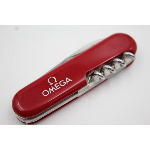 334 - A Wenger Omega collectors pocket knife with Omega leather pocket sheath