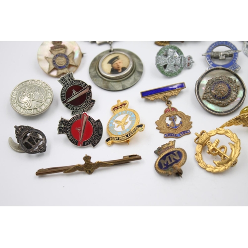 347 - Twenty assorted vintage military lapel/sweetheart badges to include R.A.F, Navy, Army etc.