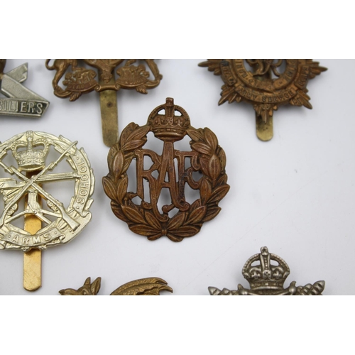 352 - Fifteen vintage military badges to include Scottish, South Staffs etc.