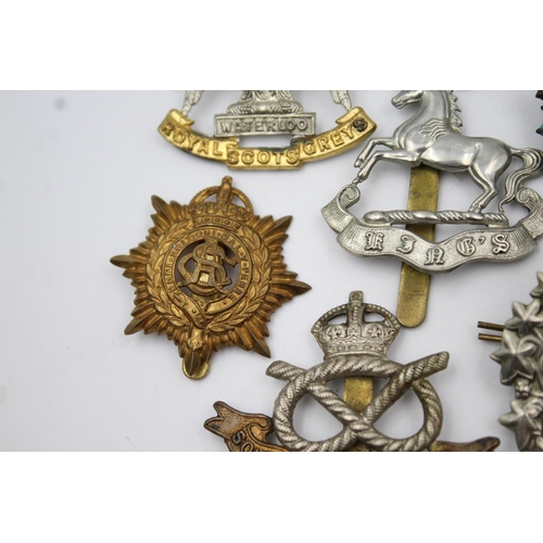 352 - Fifteen vintage military badges to include Scottish, South Staffs etc.