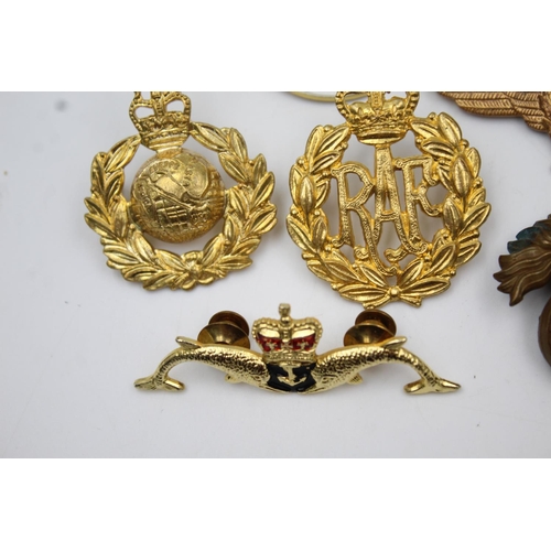 353 - Twenty four assorted military badges to include R.A.F, Submarines, Royal Marines etc.