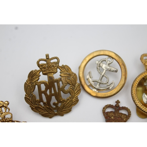 353 - Twenty four assorted military badges to include R.A.F, Submarines, Royal Marines etc.