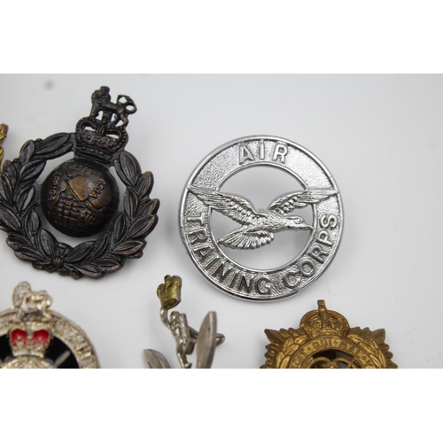 353 - Twenty four assorted military badges to include R.A.F, Submarines, Royal Marines etc.