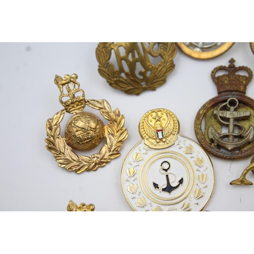 353 - Twenty four assorted military badges to include R.A.F, Submarines, Royal Marines etc.