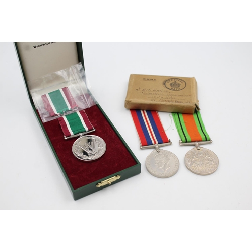 361 - Three various boxed medals, one WWII War medal, one WWII Defence medal and one Women's Voluntary ser... 