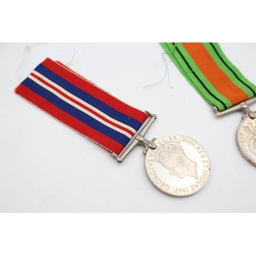 361 - Three various boxed medals, one WWII War medal, one WWII Defence medal and one Women's Voluntary ser... 