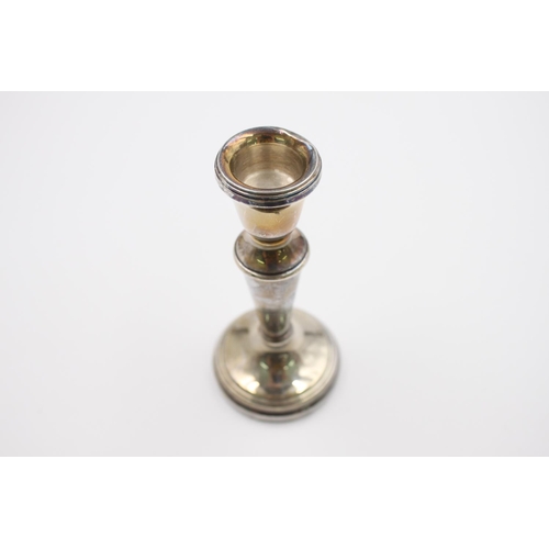 382 - Two hallmarked Birmingham silver weighted candlesticks by Roberts & Dore, dated 1989 - approx. 12cm ... 