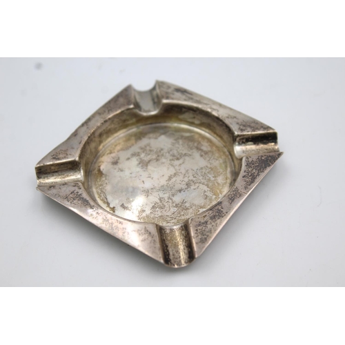 397 - Two hallmarked sterling silver items, one cigar cutter and one ashtray - approx. gross weight 39 gra... 