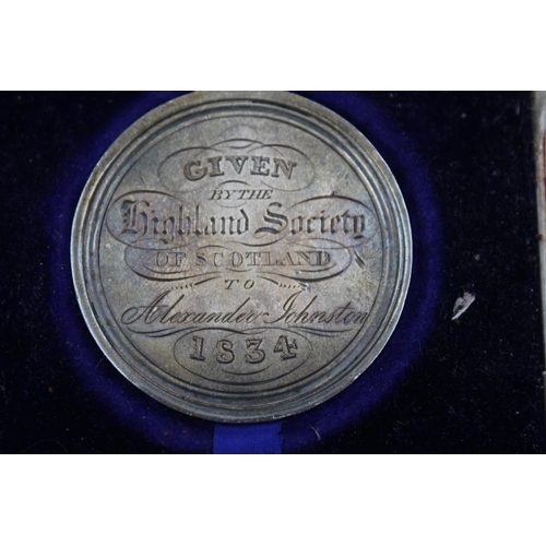 401 - A boxed William IV hallmarked Edinburgh silver Highland Society medal presented to Alexander Johnsto... 