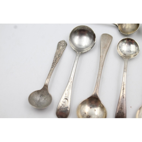 409 - Twelve assorted hallmarked sterling silver condiment spoons - approx. gross weight 53 grams