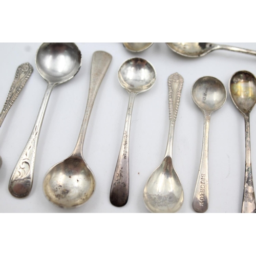 409 - Twelve assorted hallmarked sterling silver condiment spoons - approx. gross weight 53 grams