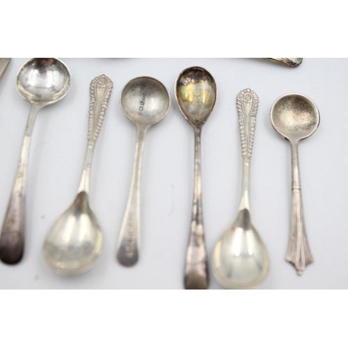 409 - Twelve assorted hallmarked sterling silver condiment spoons - approx. gross weight 53 grams