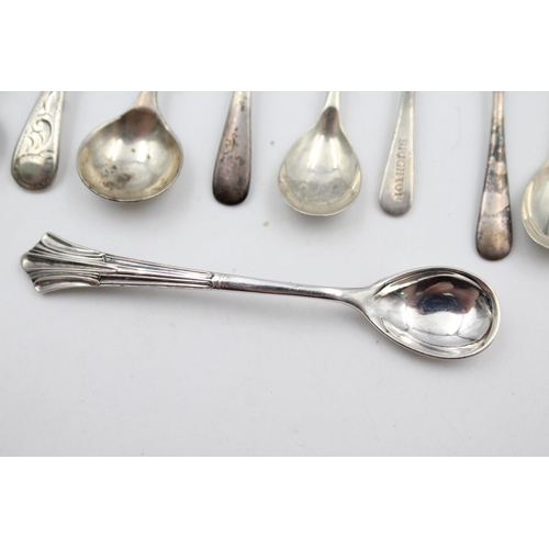 409 - Twelve assorted hallmarked sterling silver condiment spoons - approx. gross weight 53 grams