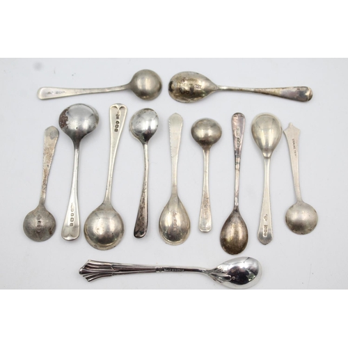 409 - Twelve assorted hallmarked sterling silver condiment spoons - approx. gross weight 53 grams